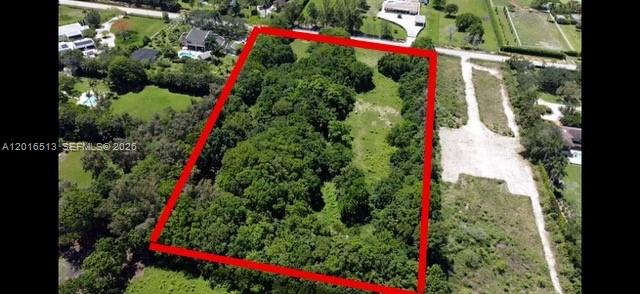 An aerial view shows a rectangular plot of land outlined in red, covered in dense trees — NA Luray Rd, Southwest Ranches FL 33330, SOUTHWEST RANCHES, FL