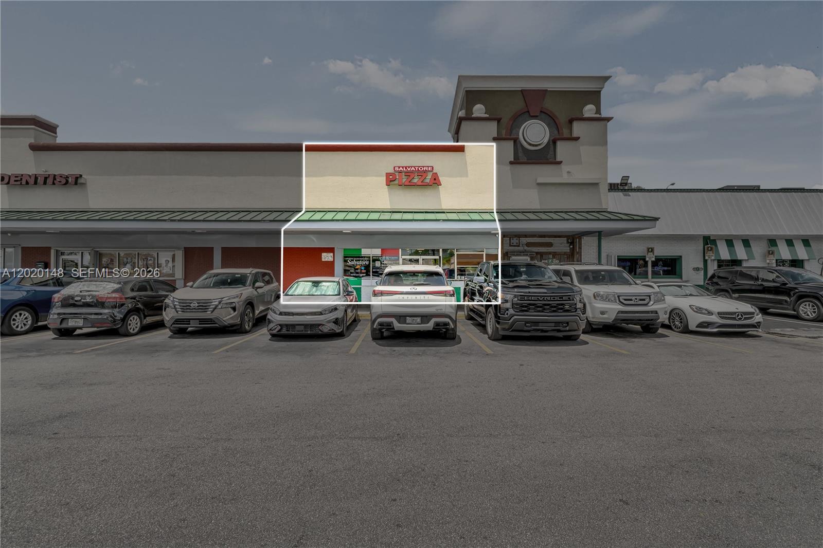 A storefront for Salvatore Pizza is located in a strip mall with a parking lot — W 84 St, Hialeah FL 33014, HIALEAH, FL