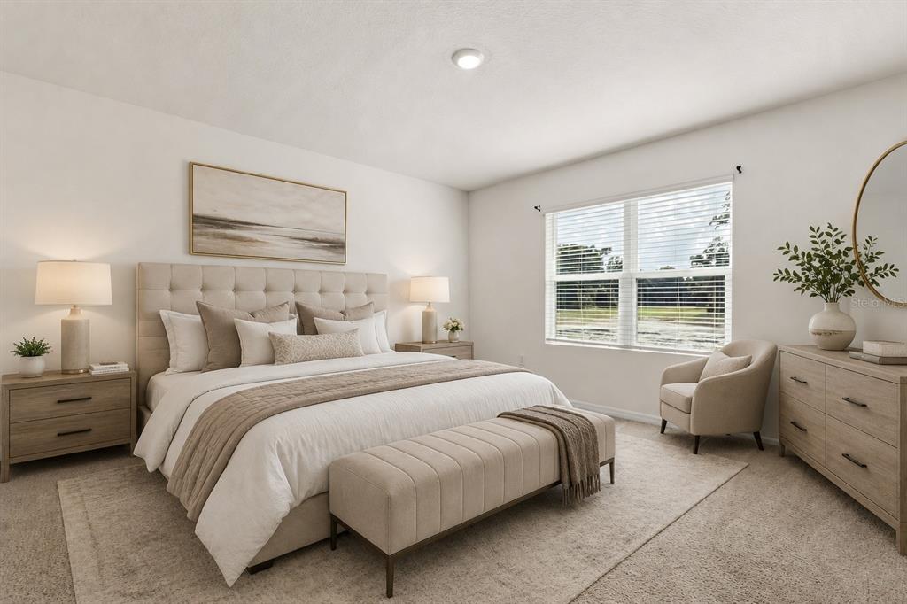 A bedroom features a king bed, two nightstands, a dresser, an armchair, and a window — 289 GINA LANE, DAVENPORT, FL