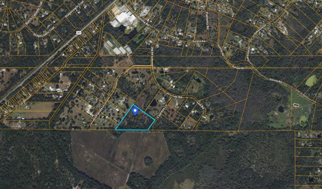 An aerial map view shows a highlighted parcel of land surrounded by rural residential roads — 14115 CYPRESS LANE, WIMAUMA, FL