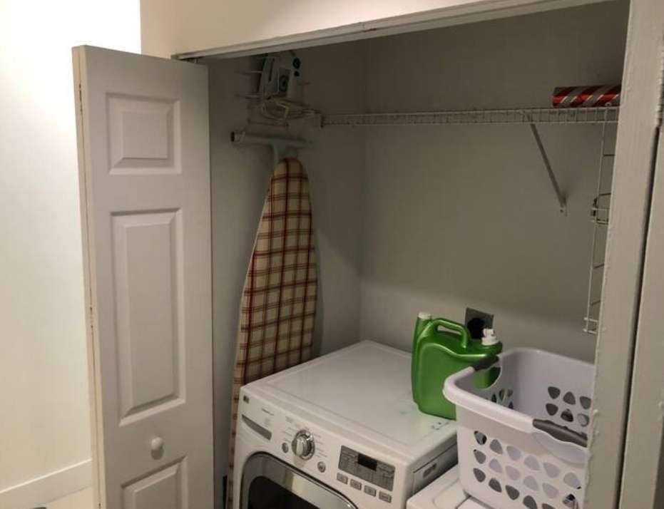 A laundry closet contains a white washing machine, a laundry basket, and an ironing board — 862 Vista Meadows Drive, Weston FL 33327, WESTON, FL
