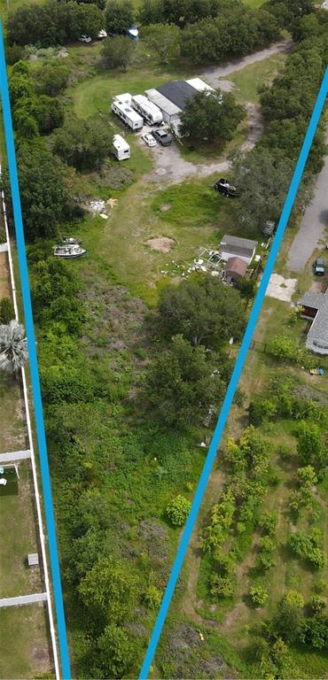 An aerial view shows a large, narrow, partially wooded lot with a house and RVs — 4122 HIGH PLAINS LANE, KISSIMMEE, FL