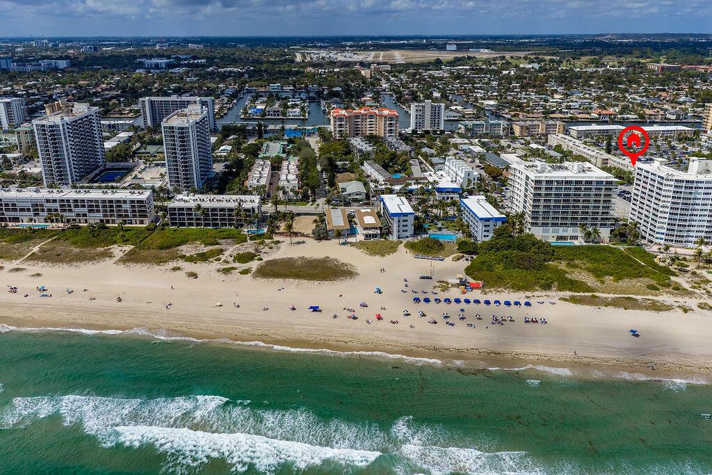 An aerial view of a beachfront high-rise residential area with a red location marker — 3200 NE 7th Court Unit 201a, Pompano Beach FL 33062, POMPANO BEACH, FL