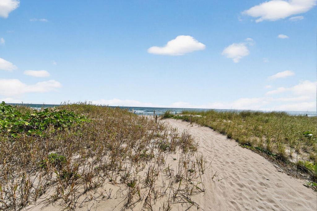 A sandy path leads through dunes covered in beach grass toward the ocean — 3200 NE 7th Court Unit 201a, Pompano Beach FL 33062, POMPANO BEACH, FL