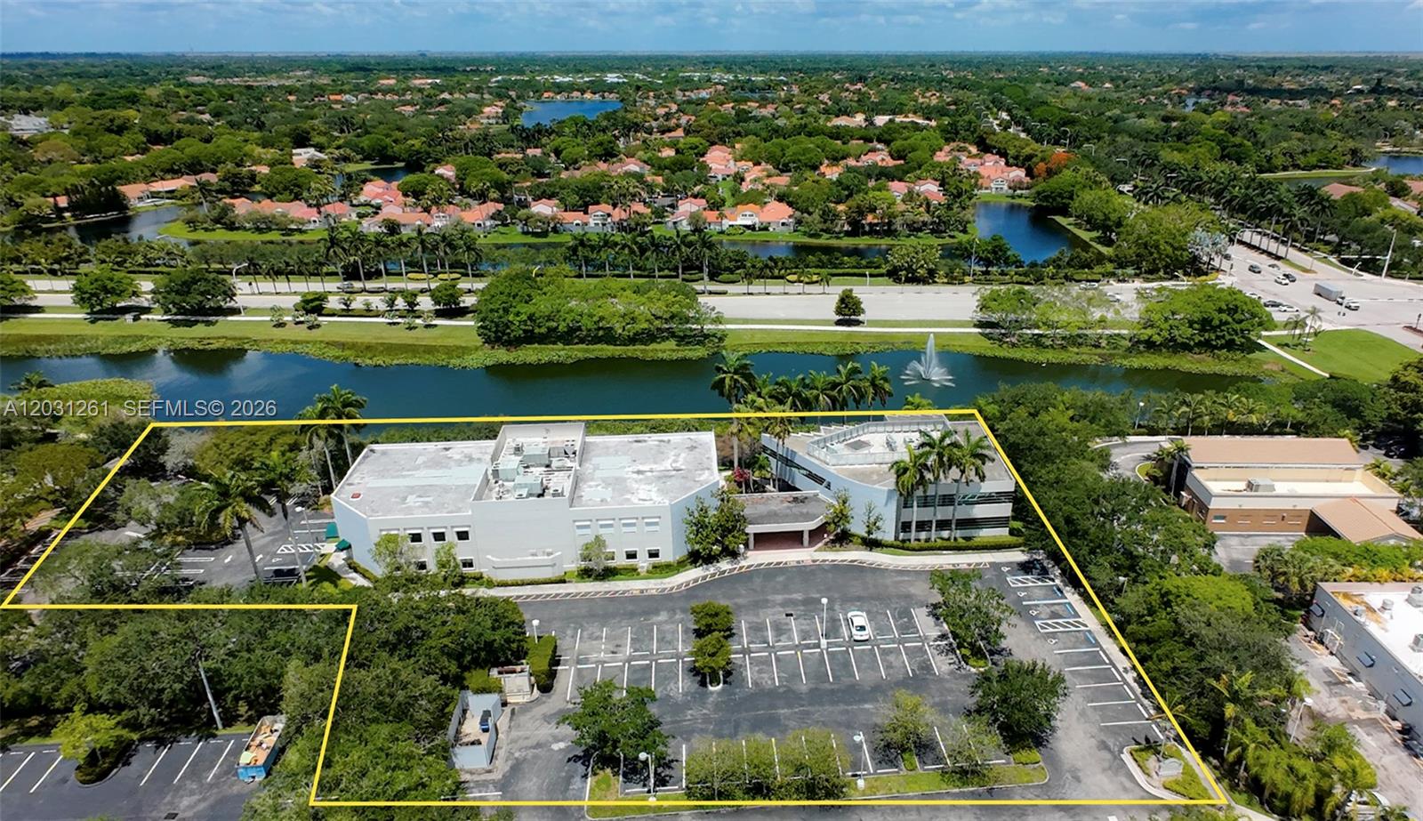 An aerial view shows two commercial office buildings surrounded by a parking lot and greenery — 1455-1485 N Park Dr, Weston FL 33326, WESTON, FL