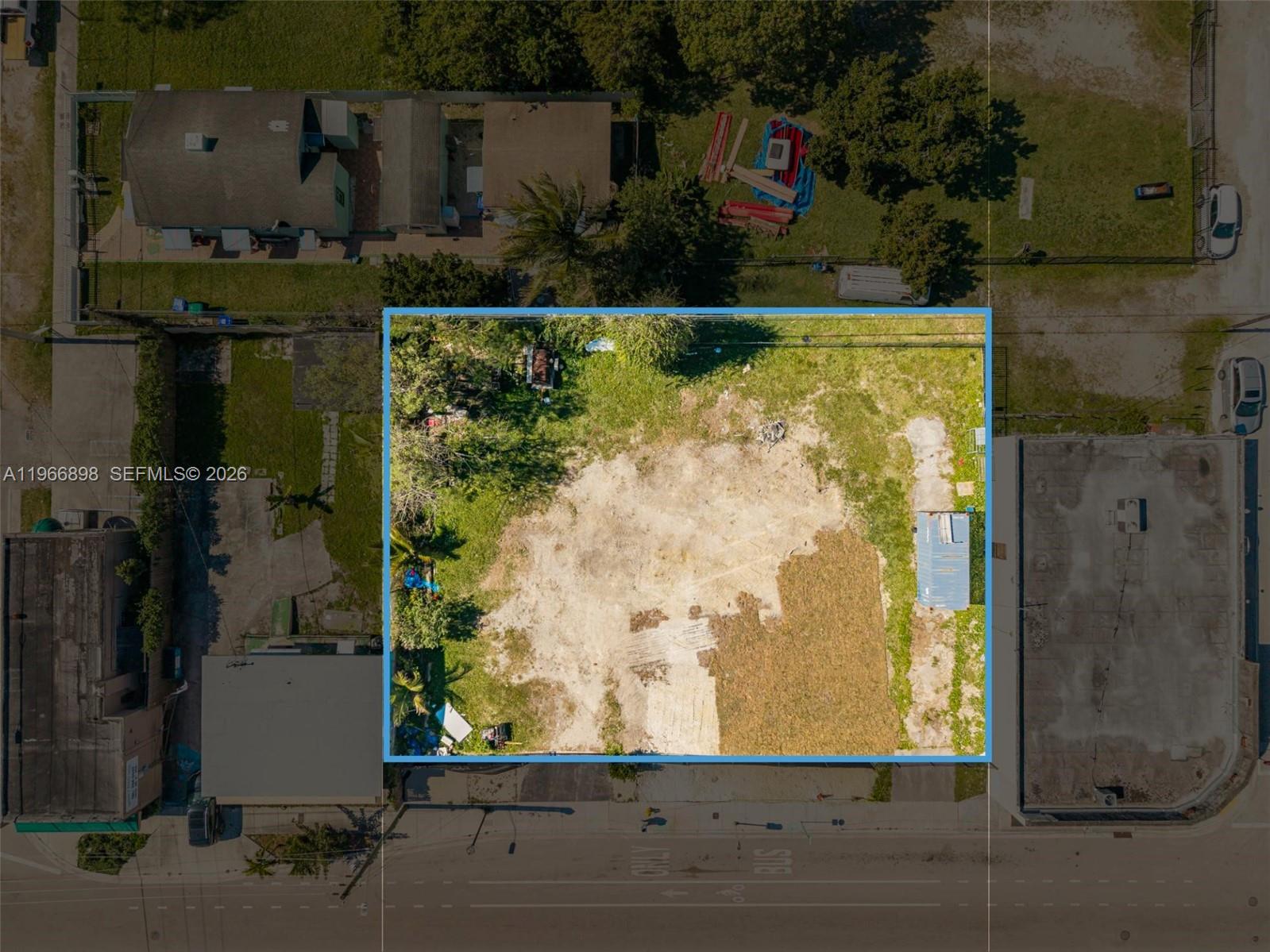 An aerial view shows a vacant, rectangular lot bordered by a street and neighboring buildings — 7618 NE 2nd Ave, Miami FL 33138, MIAMI, FL