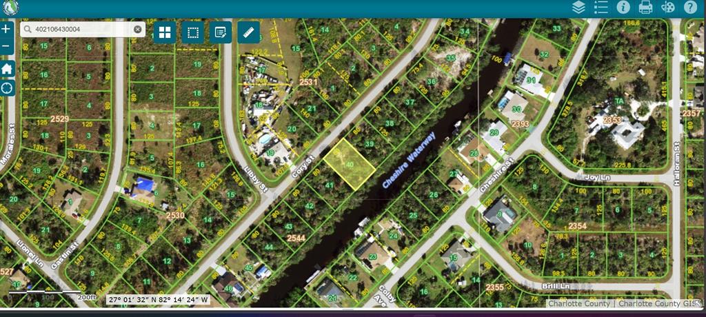 This is a satellite map showing a highlighted vacant residential lot bordering a waterway — 324 CORY STREET, PORT CHARLOTTE, FL