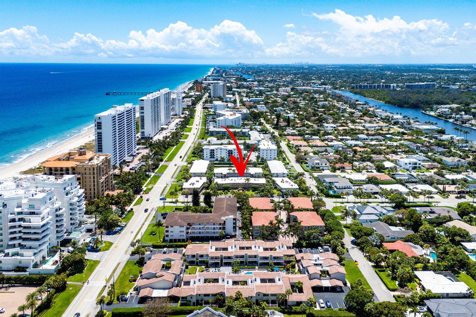An aerial view shows a coastal neighborhood with a red arrow pointing to a residential building — 930 Osceola Drive # 9, Boca Raton FL 33432, BOCA RATON, FL