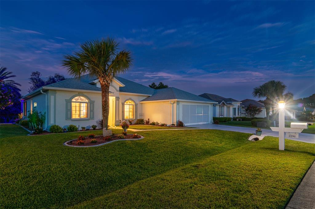 A single-story house with a palm tree and a white mailbox at dusk — 2291 NW 59TH TERRACE, OCALA, FL
