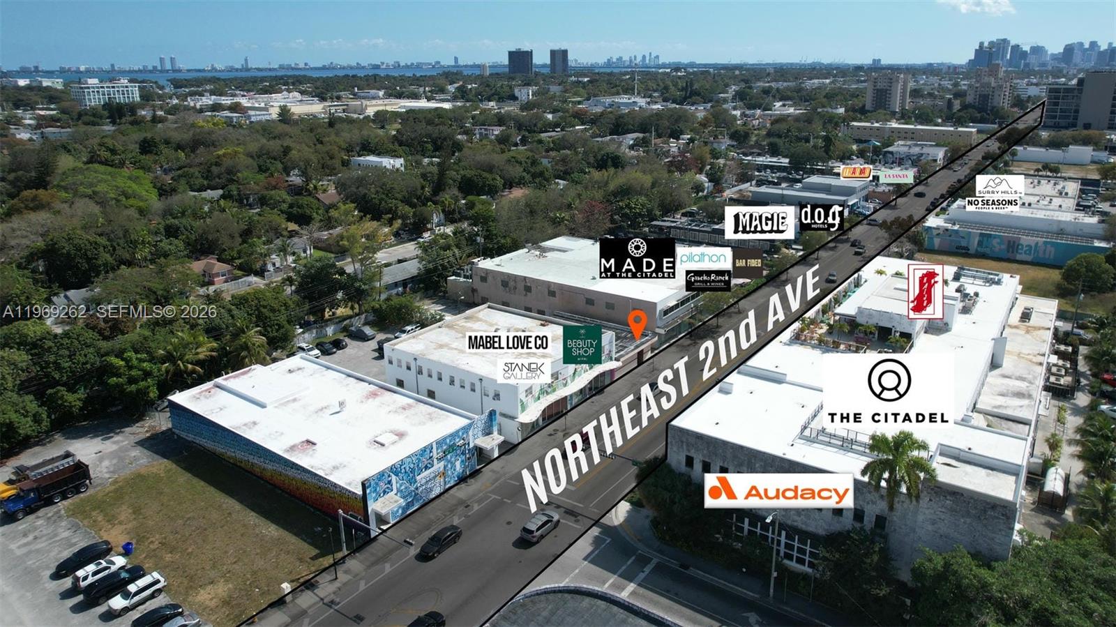 An aerial view shows a commercial building complex along a street with labeled businesses — 8333 NE 2nd Ave, Miami FL 33138, MIAMI, FL