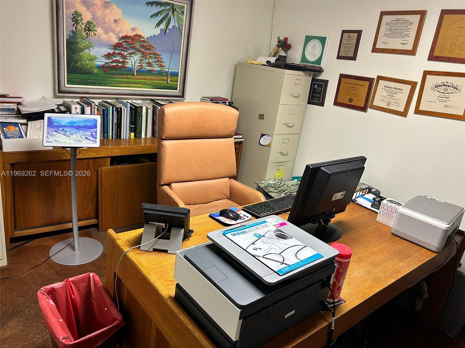A home office features a wooden desk, a tan leather chair, and framed wall certificates — 8333 NE 2nd Ave, Miami FL 33138, MIAMI, FL