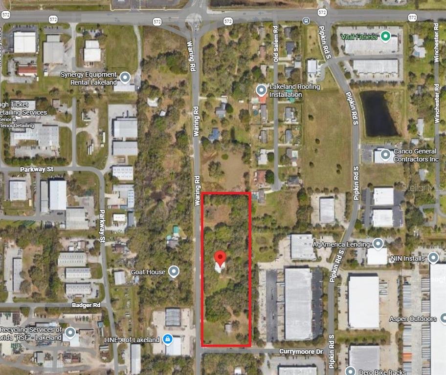 This is an aerial map showing a rectangular parcel of land outlined in red — 4040 WARING ROAD, LAKELAND, FL