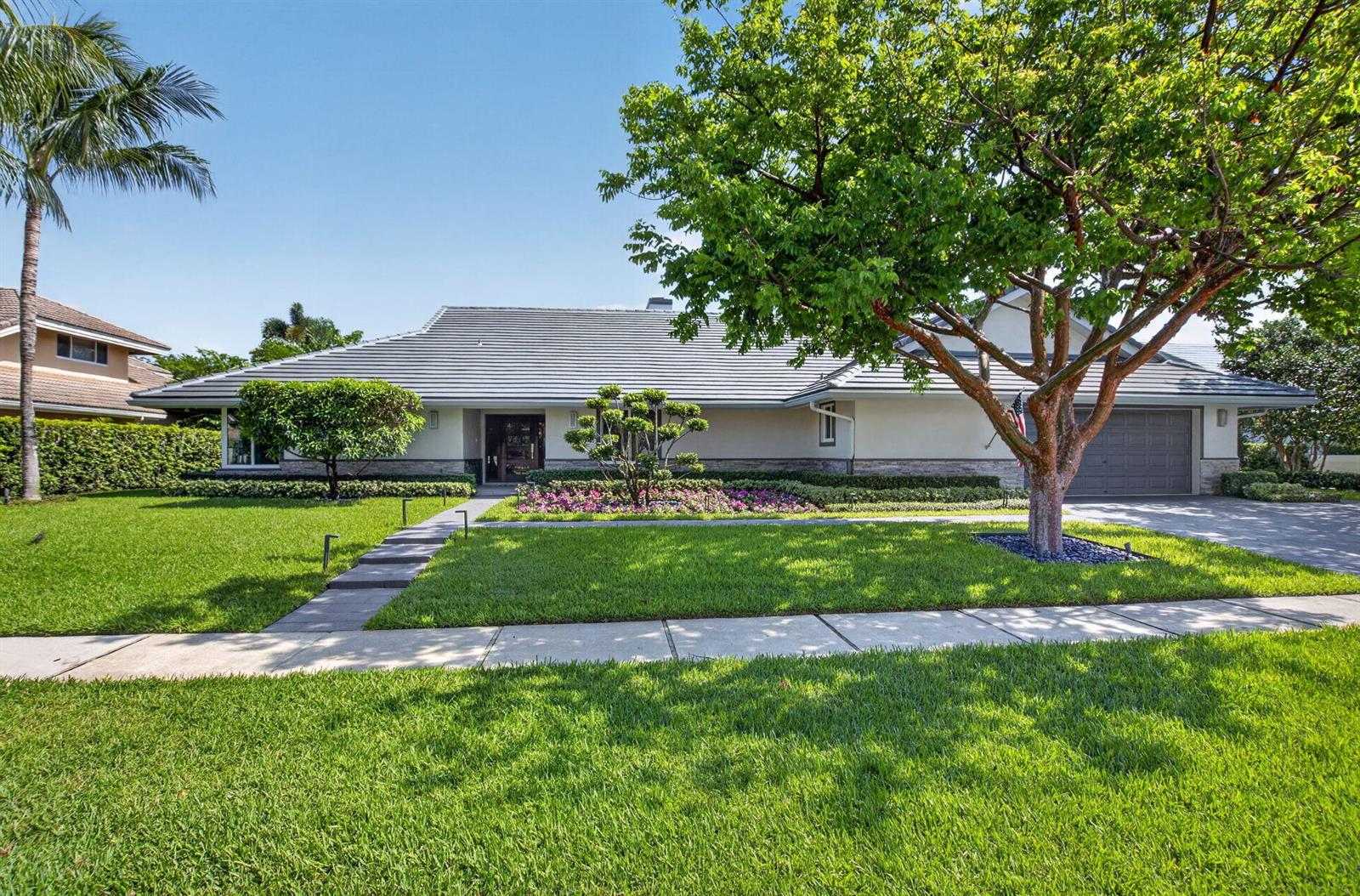 A single-story house with a gray tiled roof, a large front tree, and a landscaped yard — 3245 St James Drive, Boca Raton FL 33434, BOCA RATON, FL