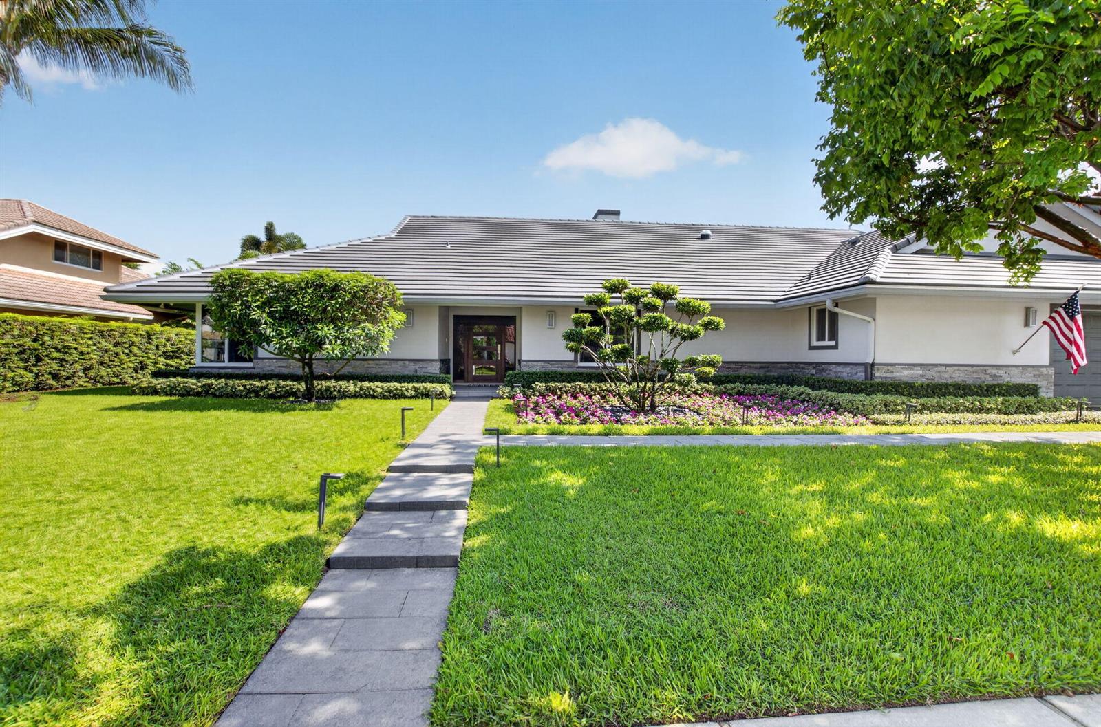 A single-story house with a gray tiled roof, stone accents, and a landscaped front yard — 3245 St James Drive, Boca Raton FL 33434, BOCA RATON, FL
