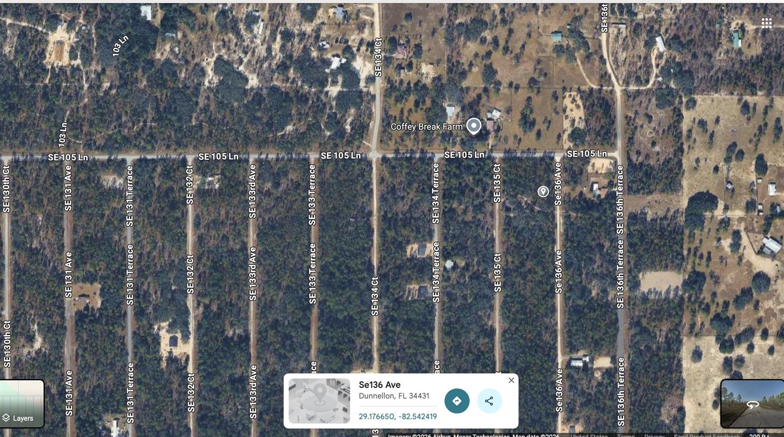 This is a satellite map view of a rural area with intersecting roads and wooded lots — 0 SE 136 Avenue, FL 32668, FL