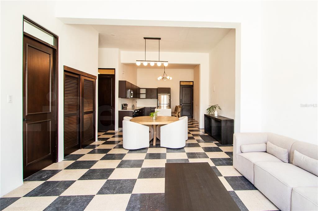 An open-concept living and dining area features a black and white checkered floor — 254-256 SAN FRANCISCO STREET UNIT 203, SAN JUAN, PR