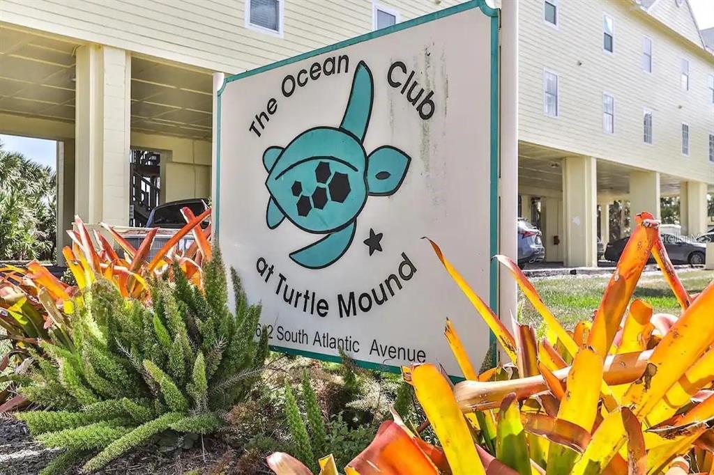 A sign for The Ocean Club at Turtle Mound stands in front of a building — 6612 S ATLANTIC AVENUE UNIT 201, NEW SMYRNA BEACH, FL