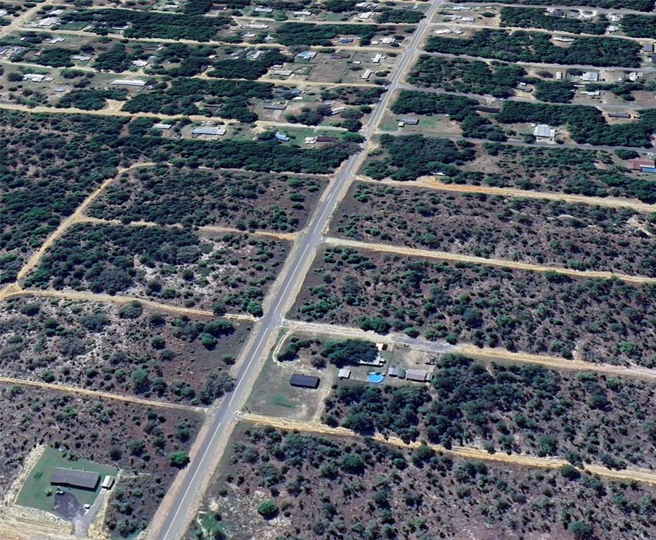 An aerial view shows a rural residential area with scattered houses and a central road — 1107 LAKEVIEW TRAIL, INTERLACHEN, FL
