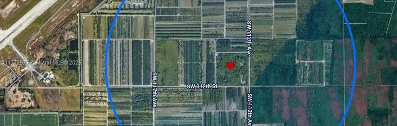 This is an aerial map showing a red dot marking a property near agricultural fields — 312 St, Homestead FL 33033, HOMESTEAD, FL