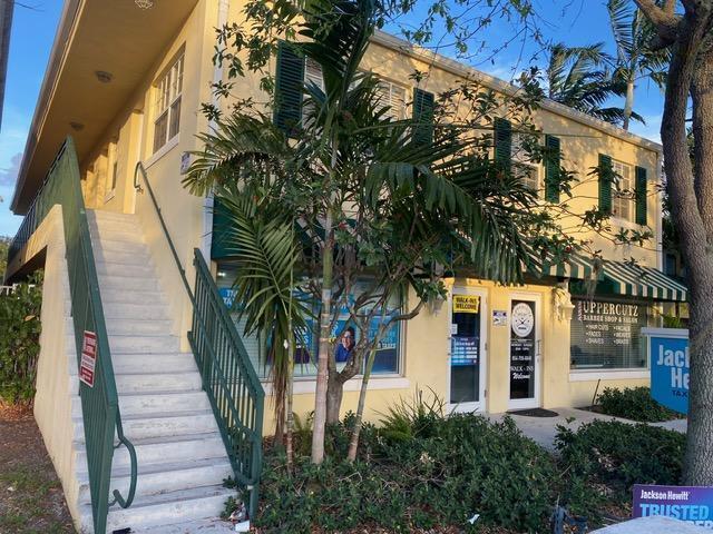 A two-story yellow commercial building features an exterior staircase and a barber shop storefront — 135 NW 5th Avenue # 3, Delray Beach FL 33444, DELRAY BEACH, FL