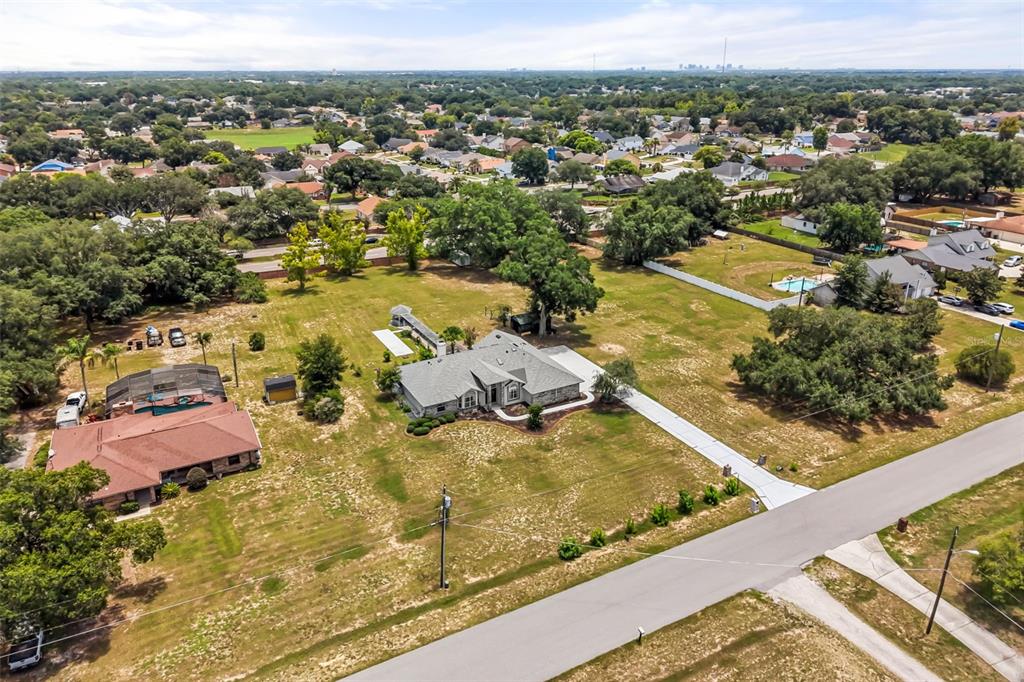 An aerial view shows a single-story house with a gray roof on a large lot — 6231 ALBETH ROAD, ORLANDO, FL
