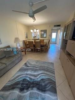 A living room with a ceiling fan, dining area, and a large patterned area rug — 1333 E Hallandale Beach Blvd # 406, Hallandale Beach FL 33009, HALLANDALE BEACH, FL