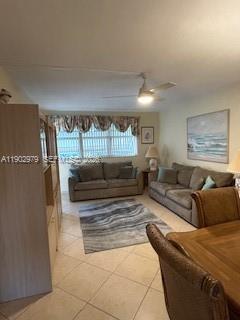 A living room with two sofas, a patterned area rug, and a ceiling fan — 1333 E Hallandale Beach Blvd # 406, Hallandale Beach FL 33009, HALLANDALE BEACH, FL