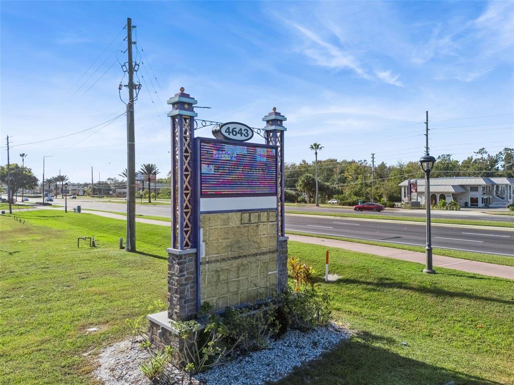A freestanding monument sign with a digital display stands on a grassy roadside lot — 4643 W IRLO BRONSON MEMORIAL HIGHWAY, KISSIMMEE, FL