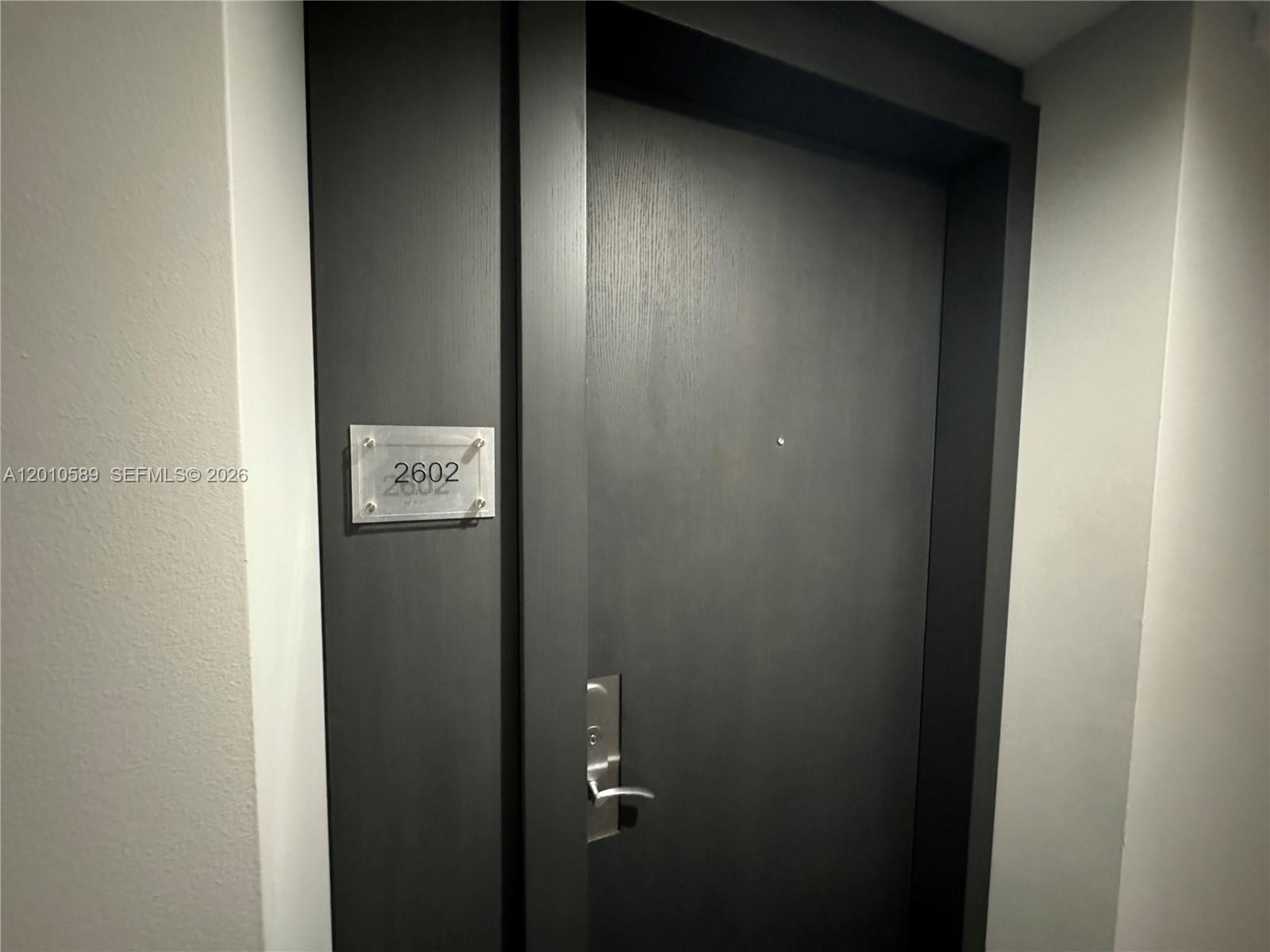 A dark wood door with a silver handle and a room number plaque — 1800 S Ocean Dr # 2602, Hallandale Beach FL 33009, HALLANDALE BEACH, FL