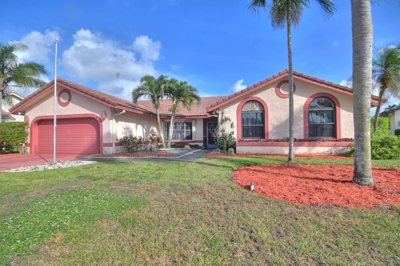 A single-story house with a red-tiled roof, stucco walls, and a two-car garage — 10226 Fresh Meadow Lane, Boca Raton FL 33498, BOCA RATON, FL