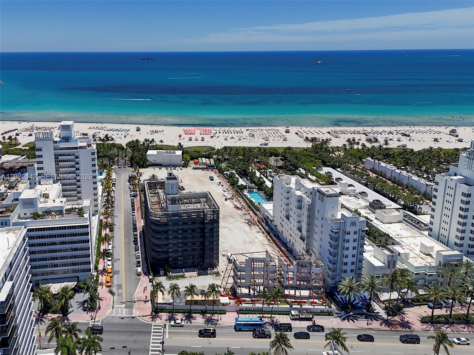 An aerial view shows a beach, ocean, and a construction site between two hotels — 235 18th St, Miami Beach FL 33139, MIAMI BEACH, FL