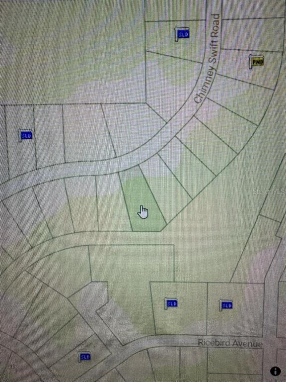This is a plat map showing a highlighted vacant lot located along a curved road — 14388 CHIMNEY SWIFT ROAD, WEEKI WACHEE, FL