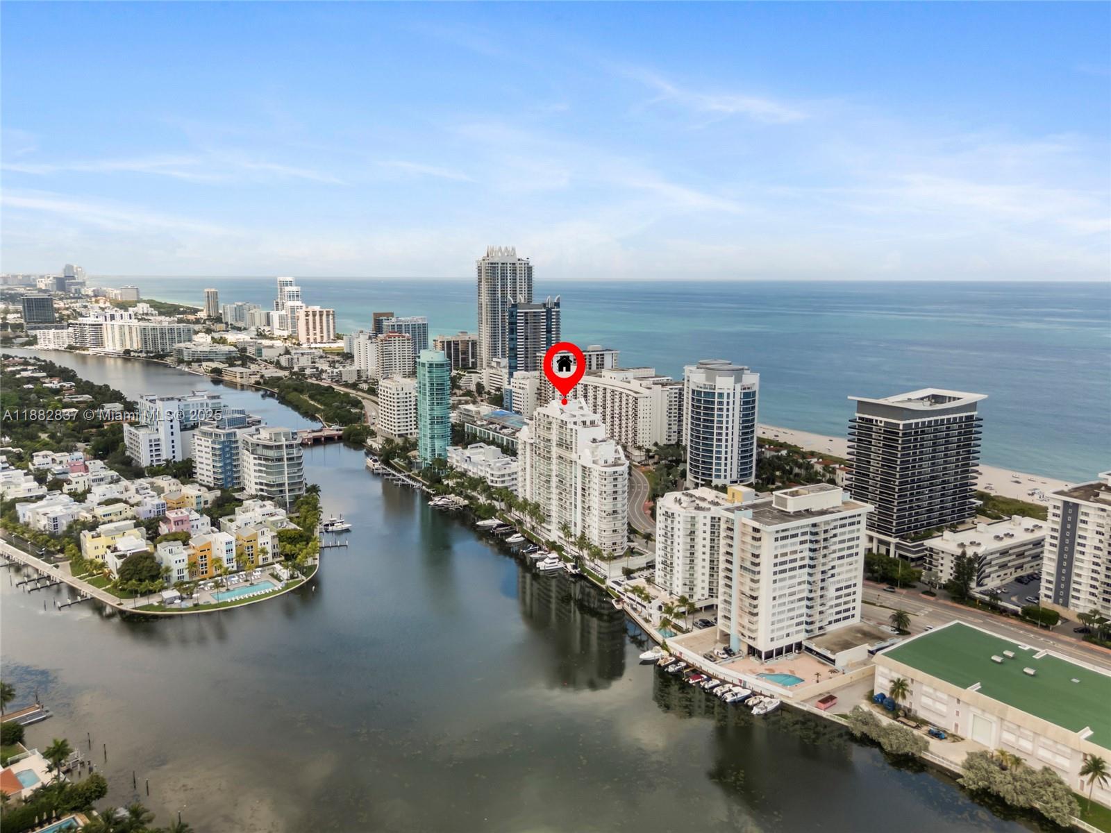 An aerial view of a waterfront high-rise building in a coastal city — 5900 Collins Ave # 604, Miami Beach FL 33140, MIAMI BEACH, FL
