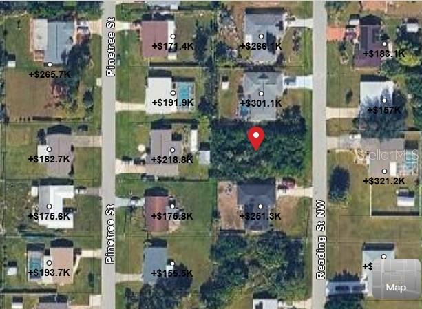 This is an aerial map showing a vacant lot marked with a red pin — 558 READING STREET NW, PORT CHARLOTTE, FL