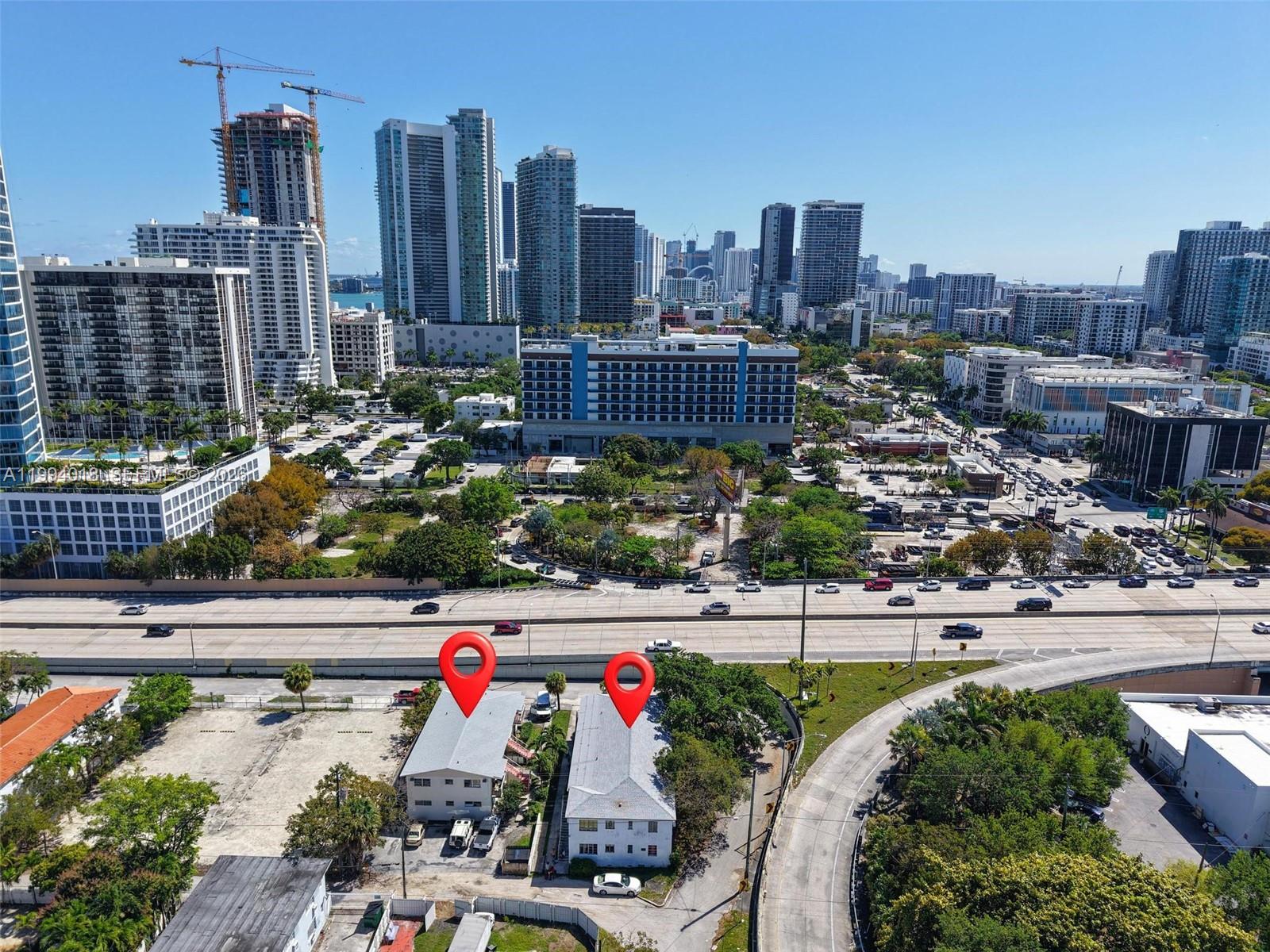 An aerial view shows two adjacent low-rise buildings situated next to a highway — 433 NE 37th St, Miami FL 33137, MIAMI, FL
