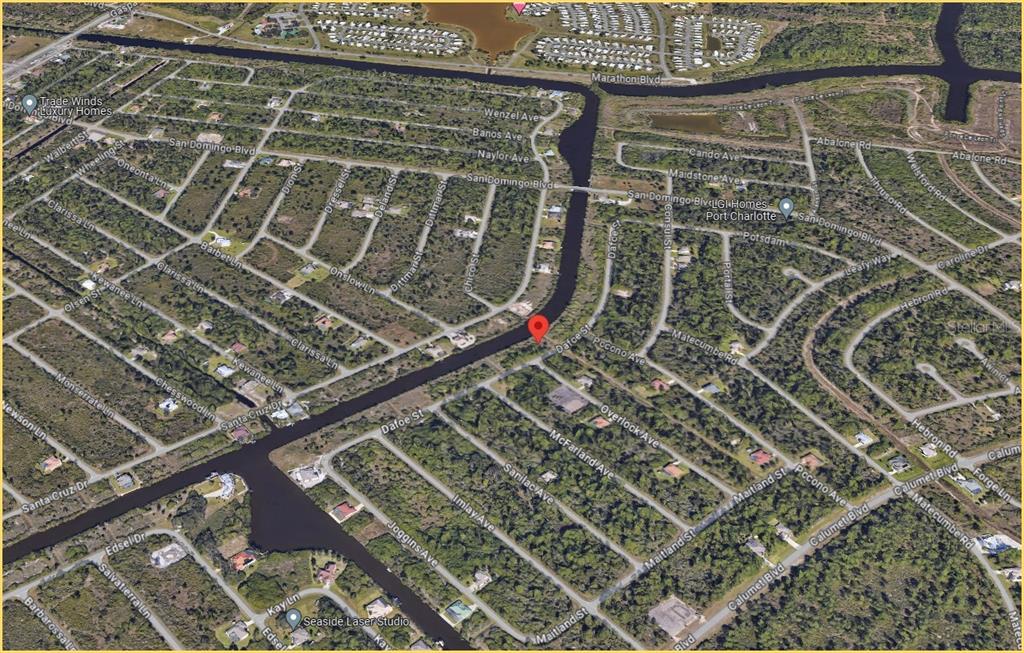This is an aerial map view of a residential neighborhood with a canal — 8301 DAFOE STREET, PORT CHARLOTTE, FL