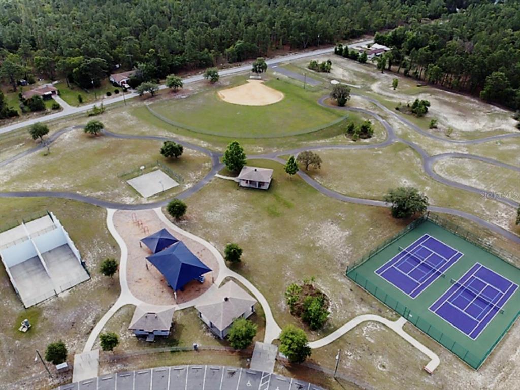 An aerial view of a public park featuring a baseball field, tennis courts, and playground — 00 SOUTHWEST VALENCIA HEIGHTS AVENUE, DUNNELLON, FL