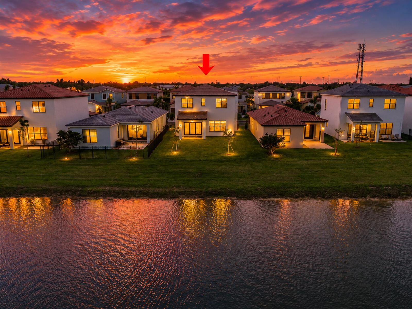 An aerial view of a two-story house with a red arrow pointing to its roof — 16469 Sea Turtle Place, Westlake FL 33470, WESTLAKE, FL
