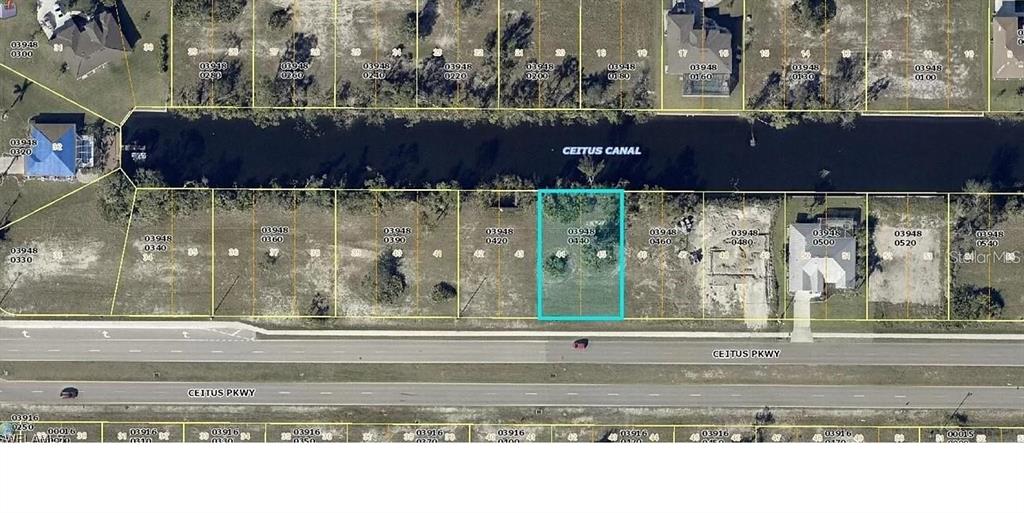 This aerial map shows a vacant residential lot highlighted in blue along a canal — 2703 CEITUS PARKWAY, CAPE CORAL, FL