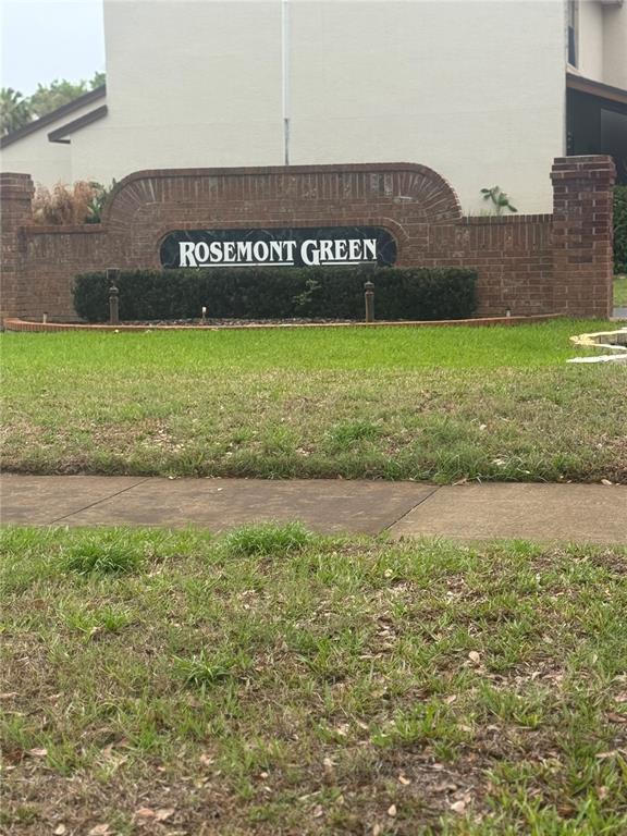 A brick monument sign for Rosemont Green sits in front of a residential building — 4123 PLAYER CIR UNIT 509, ORLANDO, FL