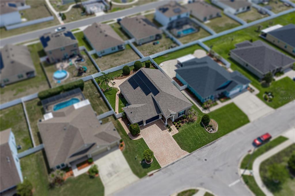 A single-story house exterior features a paved driveway, a dark garage door, and a covered entryway — 1713 VIA PALERMO STREET, PLANT CITY, FL