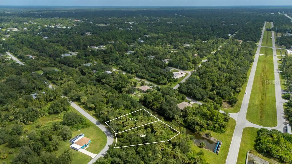 An aerial view shows two adjacent wooded lots marked 356 and 366 near a road — 356 & 366 FERDON CR. CIRCLE, PORT CHARLOTTE, FL
