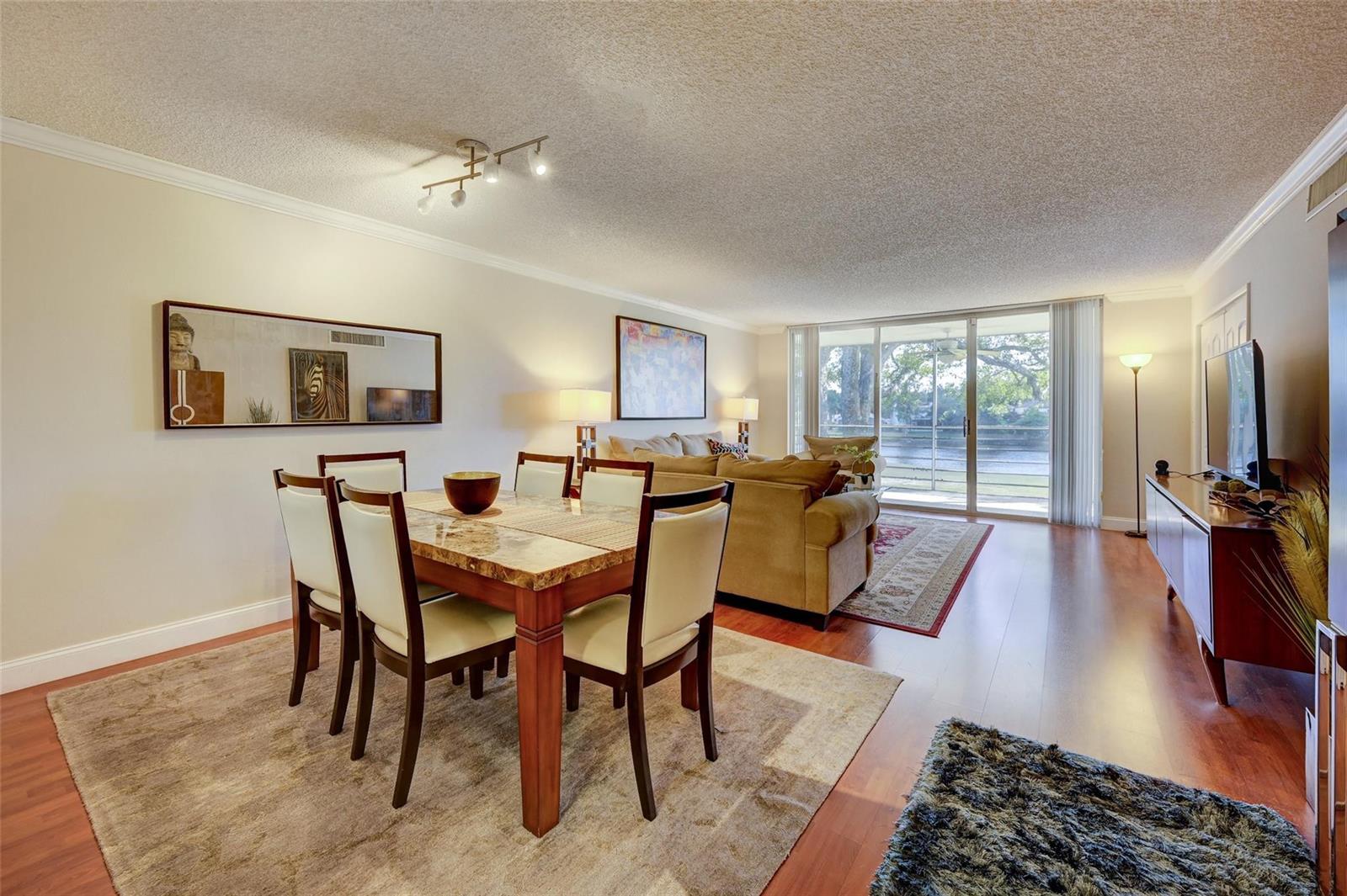 A two-story apartment building exterior with assigned parking spaces in the foreground — 823 Cypress Boulevard # 201, Pompano Beach FL 33069, POMPANO BEACH, FL