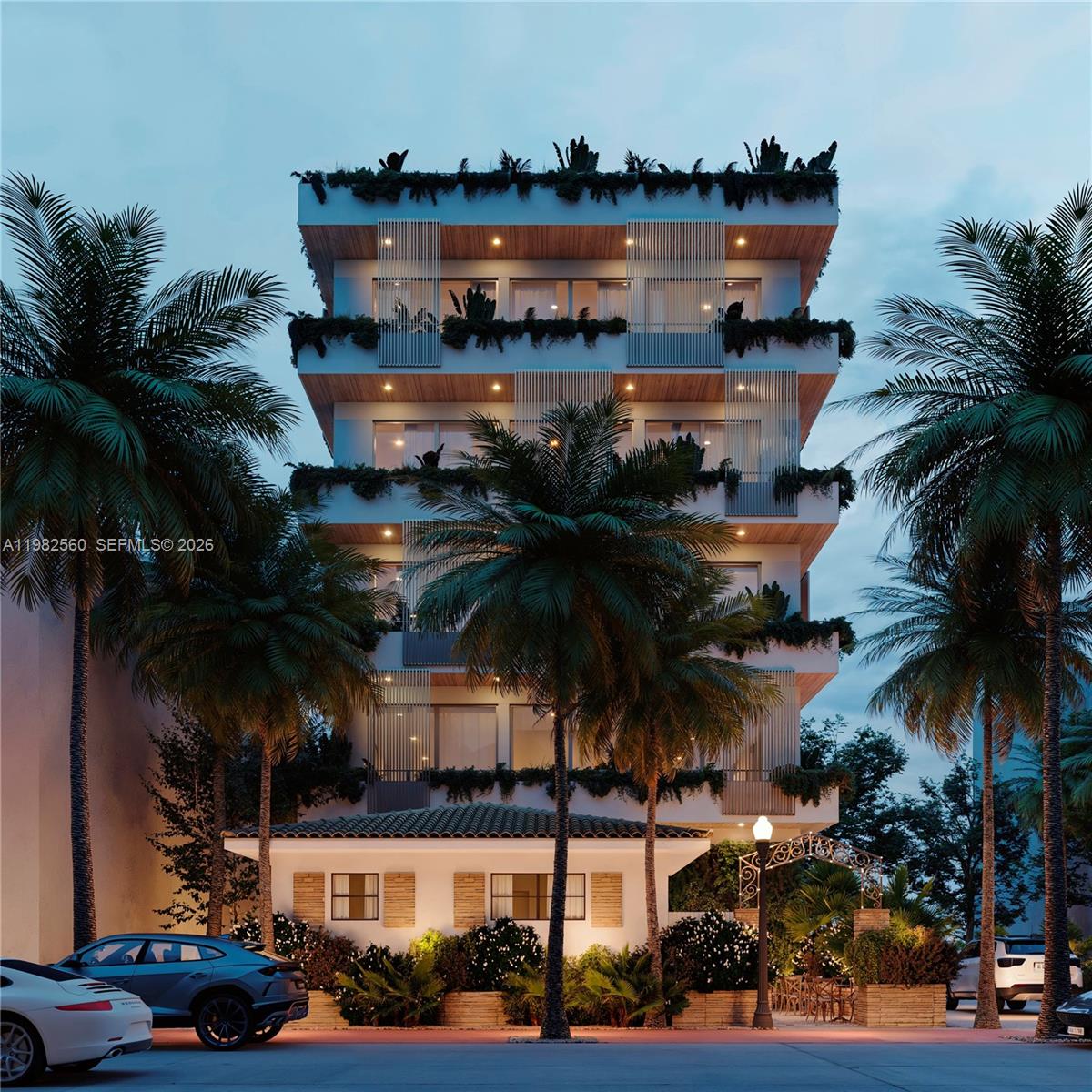 This is a rendering of a multi-story residential building with balconies and lush landscaping — 829 4th St # 4, Miami Beach FL 33139, MIAMI BEACH, FL