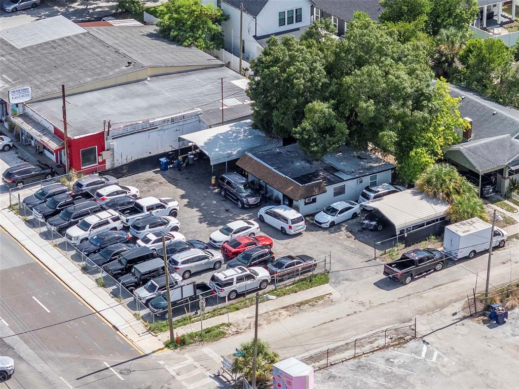 An aerial view shows a commercial property with a parking lot filled with various vehicles — 4316 N FLORIDA AVENUE E, TAMPA, FL