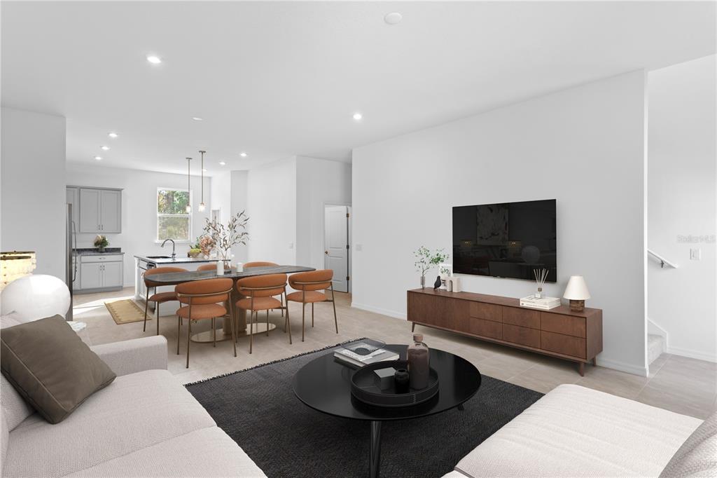 This is a digital rendering of an open-concept living and dining area with modern furniture — 9612 MONTAGUE STREET, WESTCHASE, FL