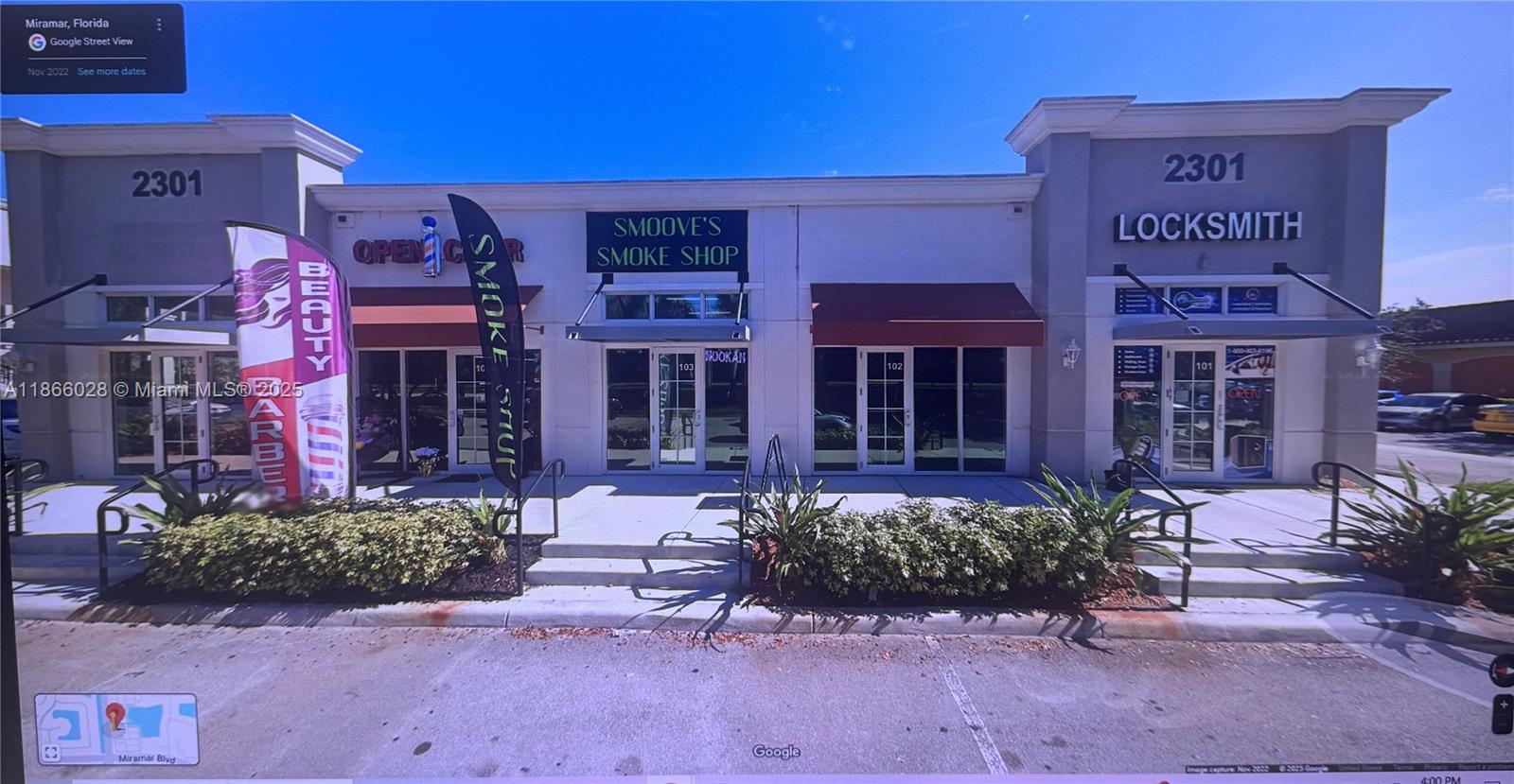 The exterior of a commercial strip mall building features multiple storefronts with glass doors — 2301 Palm Ave # 102, Miramar FL 33025, MIRAMAR, FL