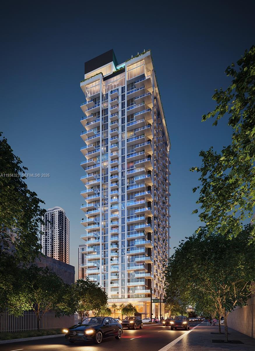 This is a digital rendering of a modern high-rise residential building at night — 11 NE 6 ST # 1407, Miami FL 33132, MIAMI, FL