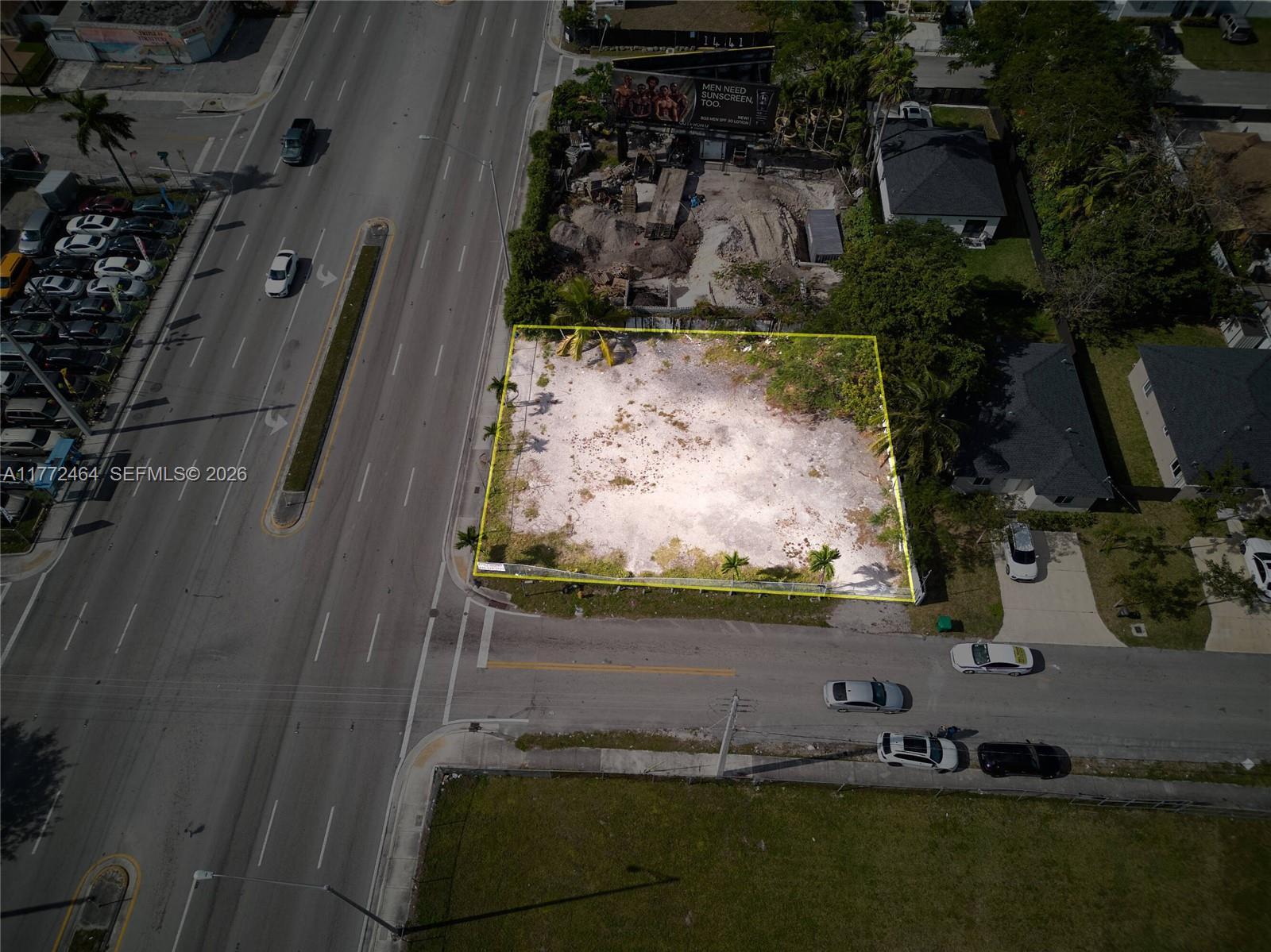 An aerial view shows a vacant, rectangular lot outlined in yellow next to a road — 1405 NW 79th St, Miami FL 33147, MIAMI, FL
