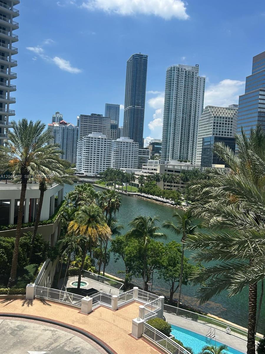 An elevated view of a canal, palm trees, and the Miami city skyline — 901 Brickell Key Blvd # 702, Miami FL 33131, MIAMI, FL